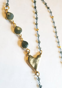 For the woman with a "Heart of Gold", we have the perfect necklace. Beautiful Labradorite beaded chain with an artisan hammered heart and a touch of sparkle.  24" with a 4" drop.