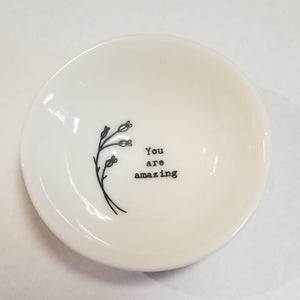 These porcelain trinket bowls are perfect to put your rings in at night, or to put your tea bag or snap mesh ball into when you are done steeping your tea!  "You are my sunshine" is printed on the right side of sprigs of flowers on the inside of the bowl.  3/4" H x 2 1