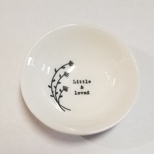 These porcelain trinket bowls are perfect to put your rings in at night, or to put your tea bag or snap mesh ball into when you are done steeping your tea!  "Little & Loved" is printed on the right side of a sprig of flowers inside of the bowl.  3/4" H x 2 1/2" Dia