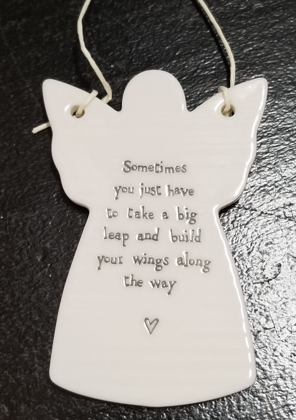 You'll love to give one of these angel-shaped porcelain ornaments to someone special! They have a cord tied to the wings so that it can hang if you would like. The words 