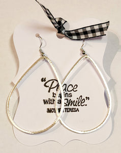 These beautiful brushed silver earrings have a teardrop shape that makes a bold statement!  Approximately 3" in length. 