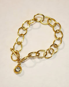 A beautiful gold bracelet to wear on its own or with some of your other favorites! The bracelet has an embossed heart at the end of the link with a pretty pearl accent below.  This 8" link bracelet has a toggle closure.   We want your jewelry to last. Therefore we do not recommend swimming, showering, or applying cosmetics or perfumes.