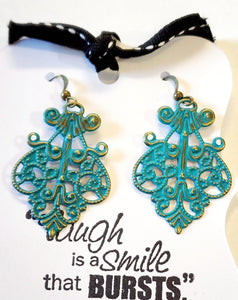 What does a modern girl wear to the ball? These little earrings will make any day feel special!  Painted in an aqua finish and distressed.  Filigree measures 1 1/2" by 1 1/8" with a 2 1/2" drop length.