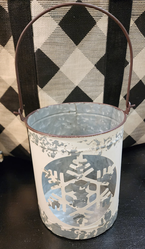 We absolutely LOVE these distressed snowflake metal luminaries!  Set this medium one on your mantel, up your staircase, on your table, or buffet with some greenery all winter long.  Don't forget to add a little votive to it for a beautiful soft glow.   Large is approximately 7