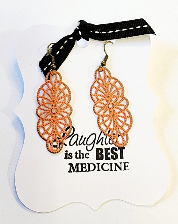 These earrings are amazingly lightweight and full of style!  Hand-painted in terra cotta and then distressed. Lead and Nickel free.  2.25