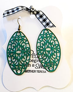 These oval earrings are amazingly lightweight and full of style!  Hand-painted in teal and then distressed. Lead and Nickel free.  2 1/2" drop 1" at the widest point.