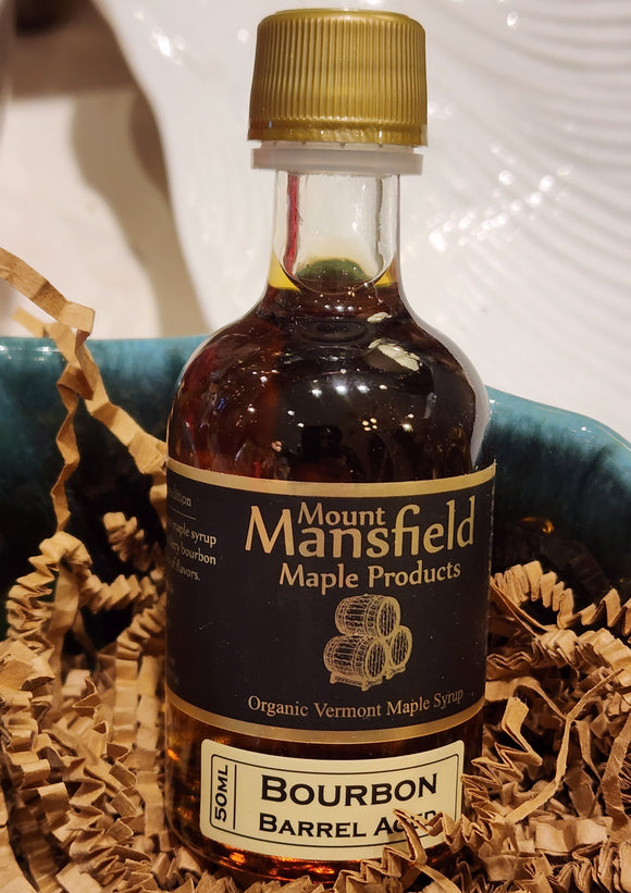 We age our 100% pure organic Vermont maple syrup in bourbon barrels we source from small, craft distilleries. As the maple syrup rests in the previously-used charred-oak barrels, it mingles with the spirit that once resided within. The result is a pleasant bite of bourbon on the nose, with a hint of cloves, vanilla, and caramel, quickly softened by the rich, silky-sweet smoothness of our select, pure Amber Rich maple syrup. Made in Winooski, Vermont, United States  50ml