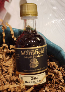 You'll love this mini bottle of Gin-Barrel Aged Maple Syrup!  We age our pure, organic Vermont maple syrup in charred oak barrels, previously used to age gin and, before that, bourbon. The syrup mingles with the two spirits, and while the kiss from the bourbon is subtle, the gin engages, imparting its lovely tones of fennel, spice, and juniper to create a complex flavor profile that is absolutely irresistible. Made in Winooski, Vermont, United States  50ml