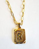 These initial necklaces are one of the hottest looks for this season!  Gold-plated rectangle initial charm with the letter "R" on it comes on a paper clip chain that is 18" long with a 2" extender and a lobster clasp closure.  Made in the USA.