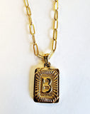 These initial necklaces are one of the hottest looks for this season!  Gold-plated rectangle initial charm with the letter "B" on it comes on a paper clip chain that is 18" long with a 2" extender and a lobster clasp closure.  Made in the USA.