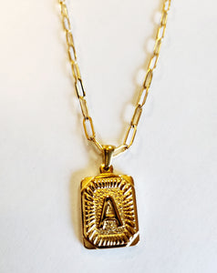 These initial necklaces are one of the hottest looks for this season!  Gold-plated rectangle initial charm with the letter "A" on it comes on a paper clip chain that is 18" long with a 2" extender and a lobster clasp closure. Made in the USA.