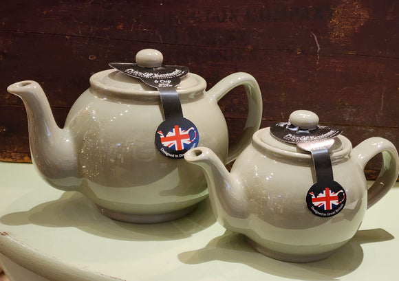 When it's time for a spot of tea, reach for one of our stoneware teapots, which can absorb the heat of boiling water without cracking. Likewise, the beautiful exterior is protected with a gloss to prevent the paint from warping or rippling. The classic bulbous shape allows tea leaves or bags to move freely for just the right amount of flavoring.   Our Sage Green teapot is available in 2-cup or 6-cup size