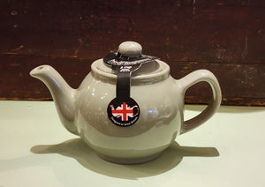 When it's time for a spot of tea, reach for one of our stoneware teapots, which can absorb the heat of boiling water without cracking. Likewise, the beautiful exterior is protected with a gloss to prevent the paint from warping or rippling. The classic bulbous shape allows tea leaves or bags to move freely for just the right amount of flavoring.   Our Sage Green teapot is available in 2-cup or 6-cup size