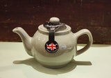 2 cup Sage Green Teapot. When it's time for a spot of tea, reach for one of our stoneware teapots, which can absorb the heat of boiling water without cracking. Likewise, the beautiful exterior is protected with a gloss to prevent the paint from warping or rippling. The classic bulbous shape allows tea leaves or bags to move freely for just the right amount of flavoring. 