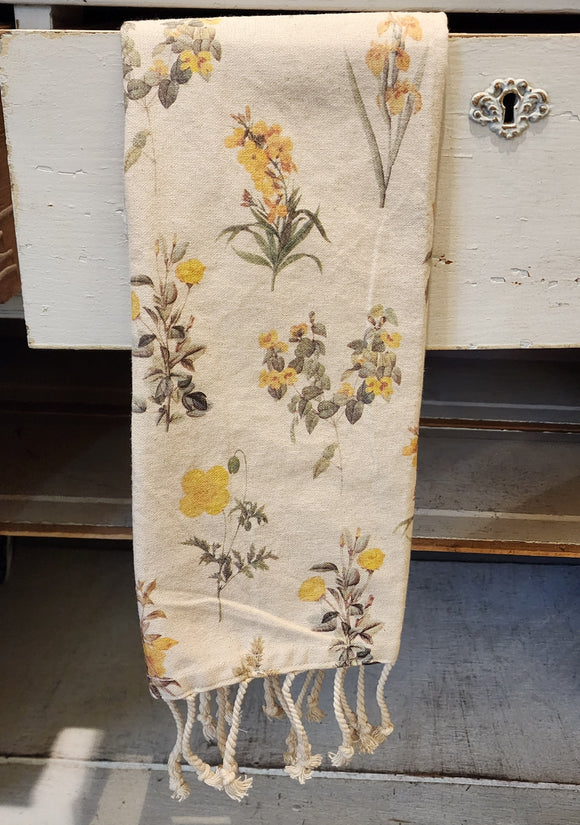 Put a bright spot in your kitchen with our cream towel with a mix of yellow flowers scattered all over it.  You'll love the cream rope fringe detail at the bottom!  27