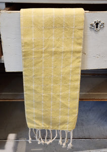 Put a bright spot in your kitchen with our yellow windowpane checked towel.  You'll love the cream rope fringe detail at the bottom!  27" H x 17" W  Cotton. Machine wash cold water.