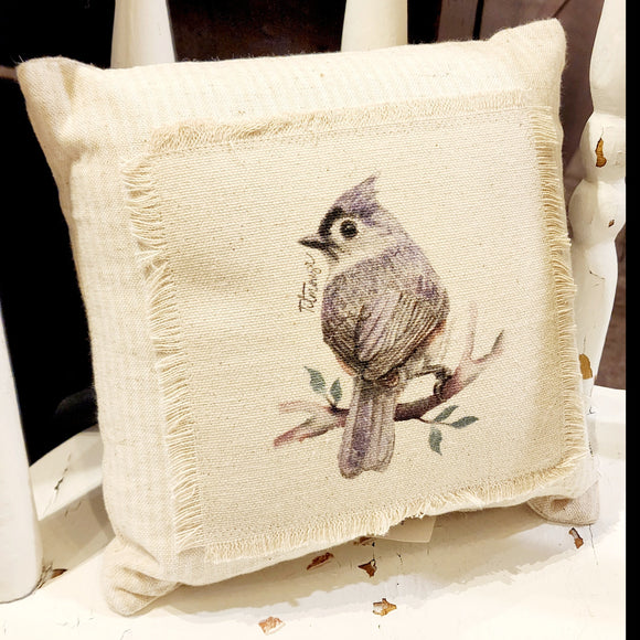 We love these sweet miniature pillows because they fit anywhere! The little titmouse is printed on a muslin fabric that has been sewn onto a cream-striped ticking fabric.   8