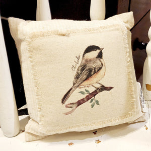 We love these sweet miniature pillows because they fit anywhere! The little chickadee is printed on a muslin fabric that has been sewn onto a cream-striped ticking fabric.   8" x 8"   Cotton, Polly Fiber