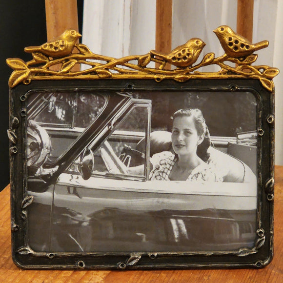 You'll love putting one of your treasured photos in our horizontal bird frame!  The frame is pewter with three gold leaf birds sitting on branches on the top of the frame ~ beautiful!  Approximately 5.5