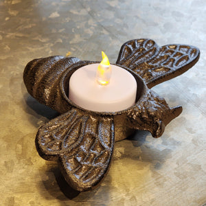 What an adorable accent for your display!  This little cast iron bee has an opening to put a battery-operated votive light in, creating a little ambiance to your decor!  0.75" H x 5.5" W x 3.5" D Cast Iron  It does not include the votive candle