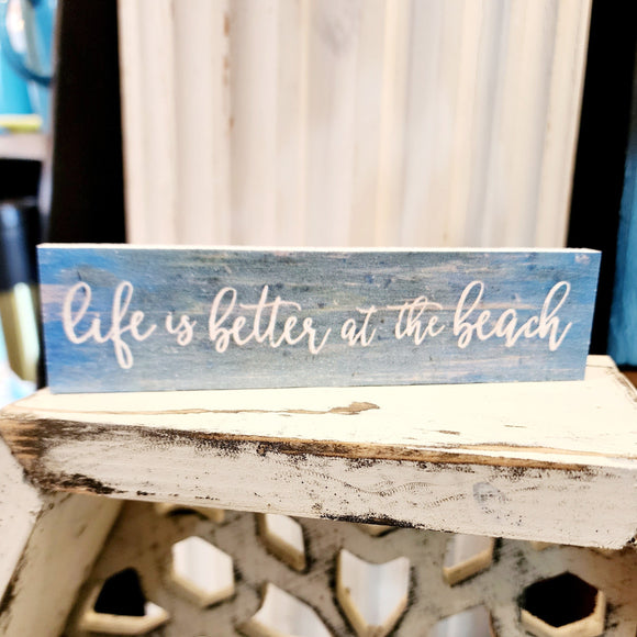 For SURE!! This turquoise distressed mini sign has the words 