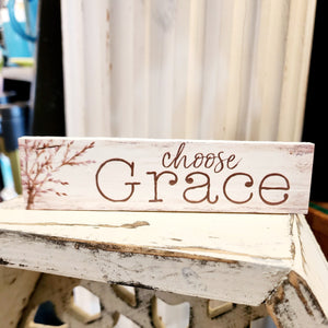 This a good reminder to keep focused on the good things! This mini sign has a black distressed background with the words "choose joy" in a white type font.   Wood Depth: 0.4375" Width: 6" Height: 1.5"