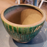 You'll love this beautiful green tiled distressed terracotta pot! Whether you put a live plant or an artificial one in it, it will accent your room perfectly! (It easily fits a three to four-inch potted plant) It has three pad protectors on the planter's base to protect the surface you place it on. Approximately 5.75" W x 5.75" W x 4.75 H