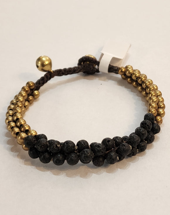This triple-clustered matte black and brass beaded bracelet is so cool! The beads are woven onto a brown cord, with two brass bell accents to hook the loop on the end to wear the bracelet around your wrist. (The bells give a little jingle as you wear it around ~ so fun!)  The first bell is approximately 6.5