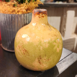Our mini vases are distressed, crackled, and come in the most beautiful shades! This moss one will look fabulous in your home with a little floral or greenery!  Ceramic  Approximately 3.75" H x 3" W