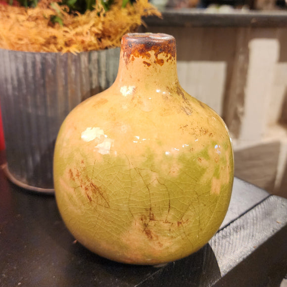 Our mini vases are distressed, crackled, and come in the most beautiful shades! This moss one will look fabulous in your home with a little floral or greenery!  Ceramic  Approximately 3.75