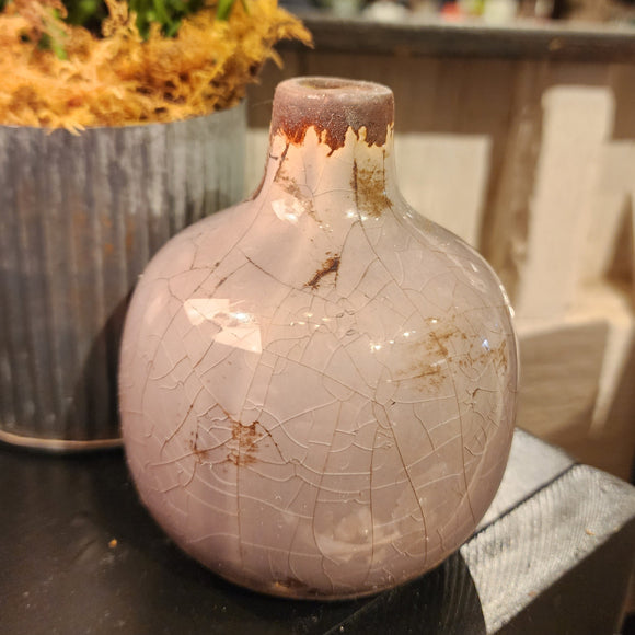 Our mini vases are distressed and crackled and come in the most beautiful shades! This lilac one will look fabulous in your home with a little floral or a bit of greenery!  Ceramic  Approximately 3.75