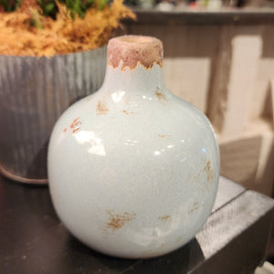 Our mini vases are distressed, crackled, and come in the most beautiful shades! This grey-blue one will look fabulous in your home with a little floral or greenery!  Ceramic  Approximately 3.75" H x 3" W