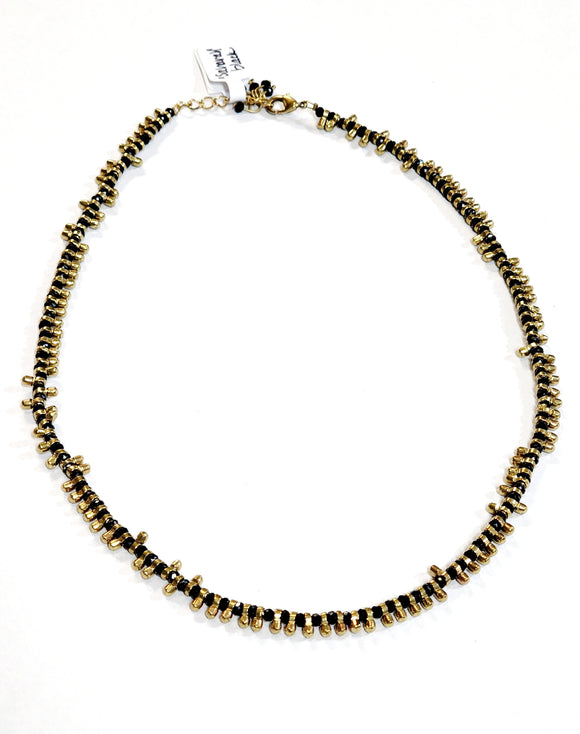 A great necklace to wear with anything! It has alternating brass toggled beads and black beads, creating a beautiful design. This 17