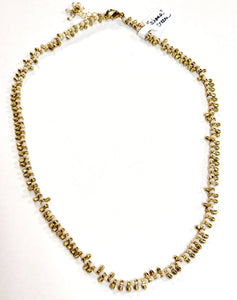 A great necklace to wear with anything! It has alternating brass toggled beads and cream beads, creating a beautiful design. This 17" necklace has a 1" adjustable chain and can be made 18" if needed ~ perfect for layering!  Handmade by a young designer and team of artists in Northern India