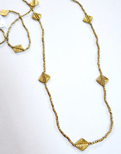 This beautiful necklace has diamond charm beads in between small brass beads that look great alone or with other necklaces.  We even like to double this one up to create a layer look too!  So many possibilities!  42" beaded necklace hangs down 21" long  Handmade by a young designer and team of artists in Northern India