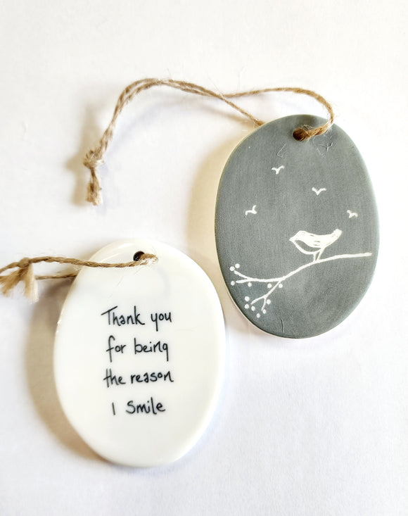 We love our porcelain ornaments because they are perfect for gift-giving! This oval ornament says, 
