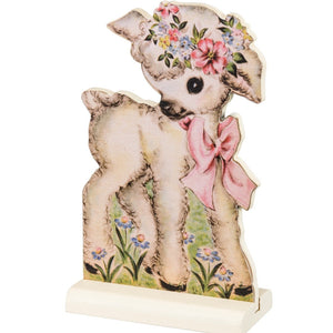 This Little vintage-inspired wooden lamb is so sweet with its big pink bow and a floral wreath around its head.  This board looks cute mixed in with your other easter decor or standing alone!  Wood, Paper  5" H x 3"W