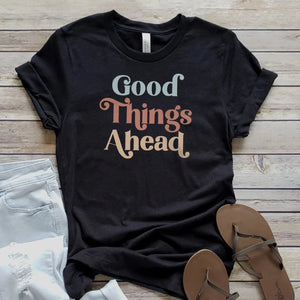 Spread positivity with our heathered black "Good Things Ahead" tee!                      Printed direct-to-fabric printing for a soft design that won't crack or peel. Shirts are soft Bella and Canvas unisex fashion fit tees that fit like a well-loved favorite, featuring a crew neck and short sleeves.  100% Airlume combed and ring-spun cotton.  Made in the United States