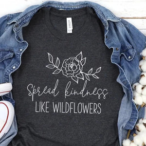 That's a LOT of kindness!! This heathered grey t-shirt has a flower above the words "Spread kindness Like Wildflowers" in a white mixed font.  It is a great reminder to all just to be kind!  These t-shirts are so soft & comfy that you will love wearing them everywhere. The styling possibilities are endless. Roll up the sleeves, tie a side knot, front tuck, or wear it while lounging around the house. 