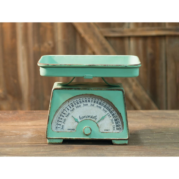 Give any kitchen some classic style with the Vintage Scale Calendar! The metal is distressed mint green and features a removable tray. Its calendar functions are adjustable and it can be set on any flat surface for a nostalgic look.  For decorative use only so it should not be used with food item