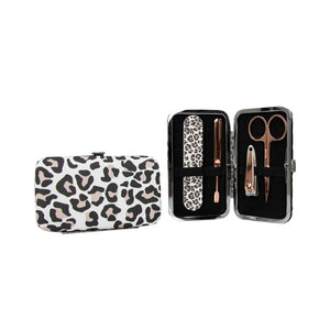 This classic leopard print purse will allow you to clip, snip, push and smooth your way to beautifully groomed fingernails. Inside the kit, there are rose gold manicure tools; scissors, fingernail clippers, a cuticle pusher, and an emery board. Tools are made from stainless steel. Keep your kit on your dressing table or pop it into your handbag for any nail emergencies on the go!  Approximately 4.75"w x 2.75"h x .75" d