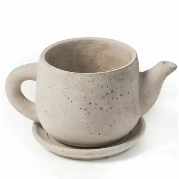 This hand-cast cement teapot will be the cutest accessory indoors or outdoors this year!  Stick succulents or air plants in them for a bit of green!   5