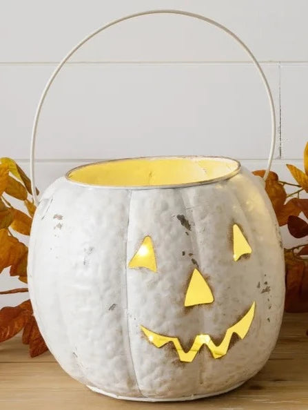 You'll love this adorable smiling Jack-o-Lantern!  It has a handle so it can be carried around or just sit in a cute spot for you to see him every day!  Use it to put your candy in for your trick-or-treaters, or stick one of our LED flickering candles in it for some Halloween ambiance!  9.5