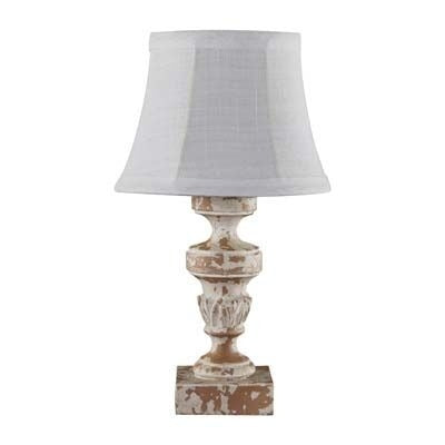 a white/cream distressed accent lamp with a square base and white linen shade