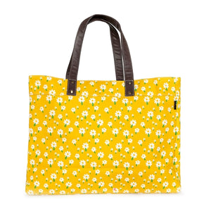 These sweet daisies on a yellow background make such a cute & happy print! Our carryall tote makes a great bag to take to the beach, class, or to the gym. This roomy utility tote features 3 interior pockets, and a strap and hook to attach our pouches. The waterproof lining makes cleaning a breeze. Jackpot!  Care Instructions: Spot-clean gently as needed  18" x 14" x 6"  Made in India