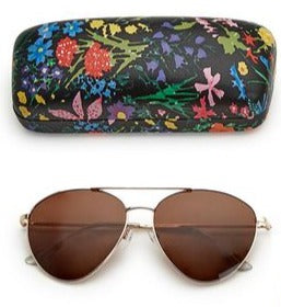 This vintage-inspired gold Aviator Frame is perfect for looking good while you are out playing in the sun!  The smoke-colored gradient lenses are wipeable, and have 100% UV protection.  The sunglasses come with a cheerful black floral print case. Metal/Polycarbonate  sunglasses: 2"L x 5 1/2"W x 1"H  case: 6 1/2" W x 3" L x 2"
