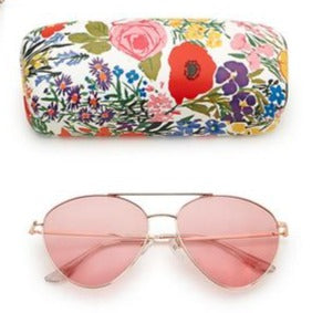 This vintage-inspired rose gold Aviator Frame is perfect for looking good while you are out playing in the sun!  The smoke-colored gradient lenses are wipeable, and have 100% UV protection.  The sunglasses come with a cheerful white floral print case.  Metal/Polycarbonate  sunglasses: 2"L x 5 1/2"W x 1"H  case: 6 1/2" W x 3" L x 2"