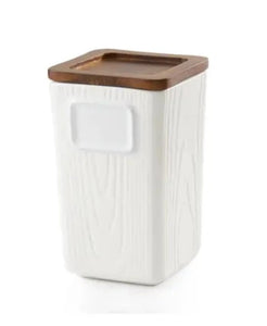 You will love using our new loose-leaf, stackable tea canister.  The stoneware canister is white with a textured woodgrain finish. It has a space on the front so you can write what tea is in your canister with a dry-erase marker. It has an Acacia wood lid with a silicone airtight seal, making it perfect for storing teas.  The canister is dishwasher-safe. Hand wash the lid if possible.  BPA Free  24oz  9.8" l x 8" w x 6" h