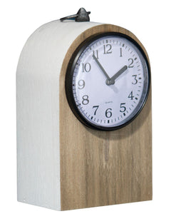 Keep track of time with this traditional tabletop clock. The arched wood structure features a warm wood front accented by a clean white border and elevated by a glass cover over the clock face sealed with a black metal rim. At the top of the arch, you'll find a decorative metal loop as an added detail. Its natural colors allow this clock to be styled with ease, while still maintaining a timeless feel.