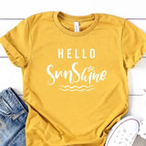 Be a bright spot in someone's day with our "Hello Sunshine" t-shirt! It is a lovely sunny yellow color with "Hello Sunshine" written in a white mixed font. We love the sun-shine dotting the "i" and the squiggly waves below...it makes for the happiest t-shirt ever!  These t-shirts are so soft & comfy that you will love wearing them everywhere. The styling possibilities are endless. Roll up the sleeves, tie a side knot, front tuck, or wear it while lounging around the house. 